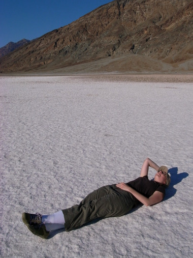 Stephanie laying down on Badwater Basin