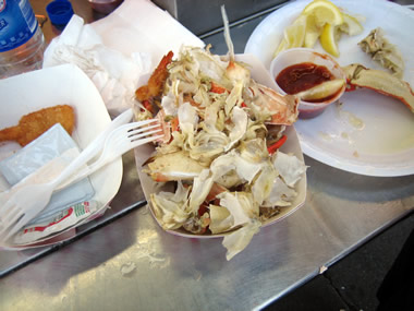 remains of a dungeness crab and some delectable fried shrimp at a fisherman's wharf crab stand