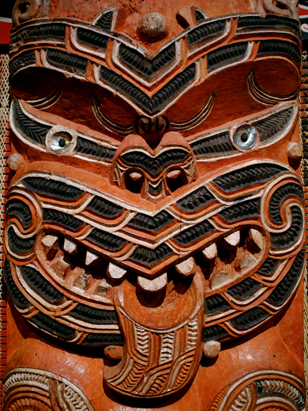 Carved face on one of the spines of the Hotunui wharenui