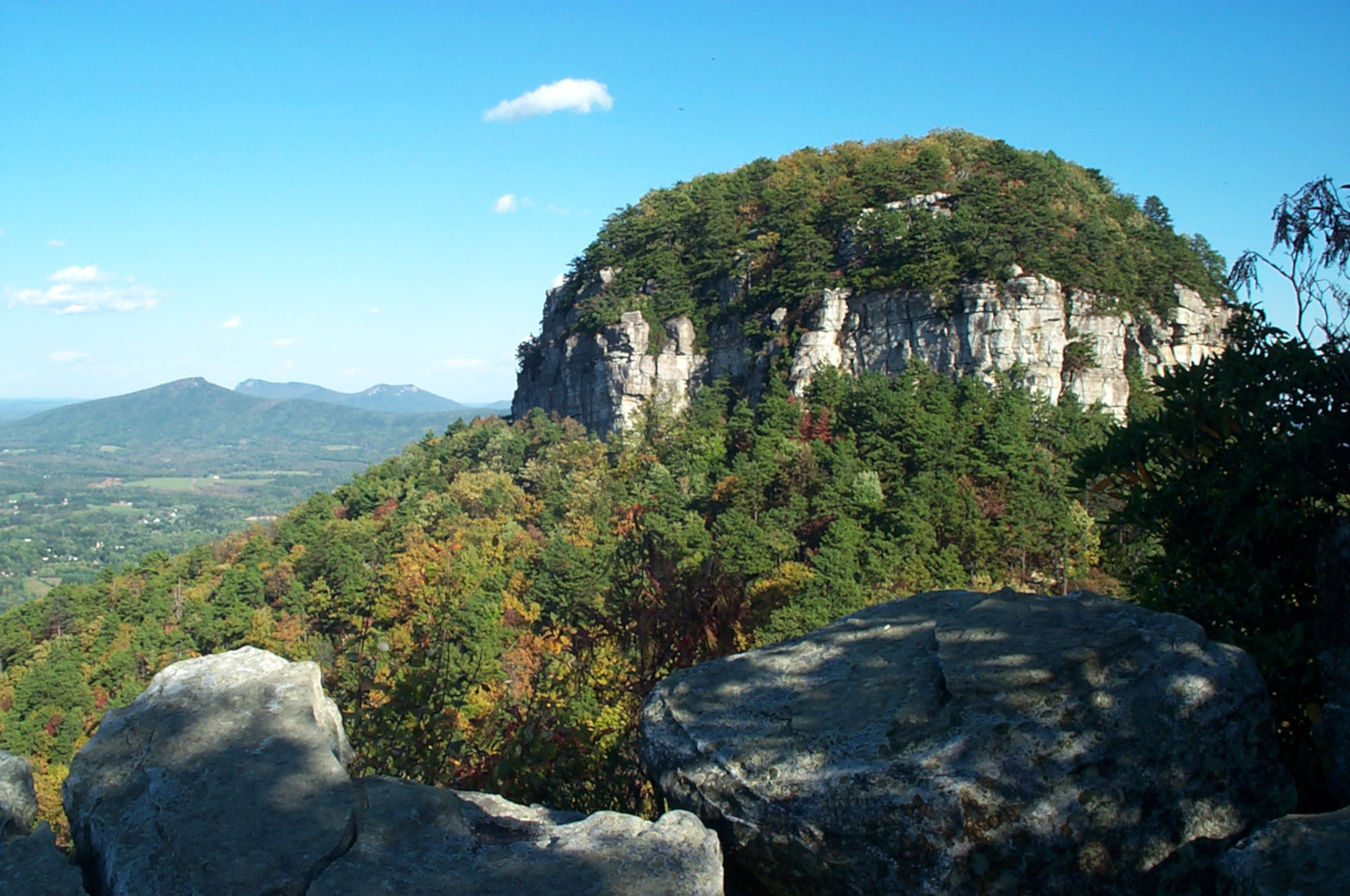 pilot mountain with unknown mountains in the distance