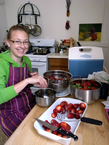Stephanie stemming strawberries for jam
