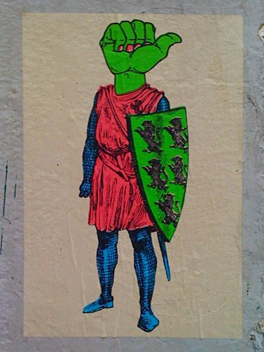 Mysterious wheatpaste at Juniper and Folsom: knight with a thumbs-up head