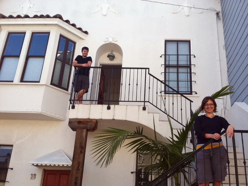 Justin and Stephanie on the steps of their new condo