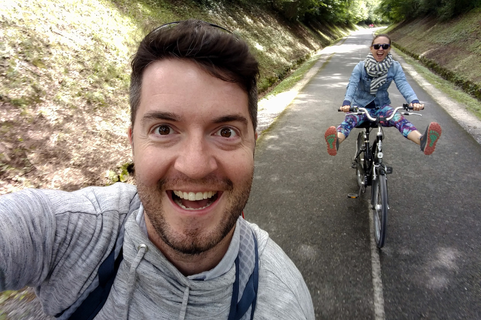 Justin riding a bike with Stephanie in Annecy, France