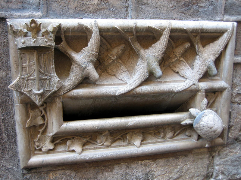 Lucky turtle and swallow mail slot at the Casa de l'Ardiaca (Archdeacon's House) in Barcelona, Spain (copyright Kathryn Watt)