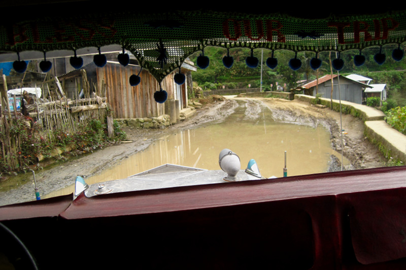 Big puddle on the road to Batad, Philippines (seen through jeepney)