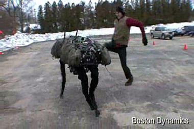 Someone from Boston Dynamics kicking a robot called BigDog