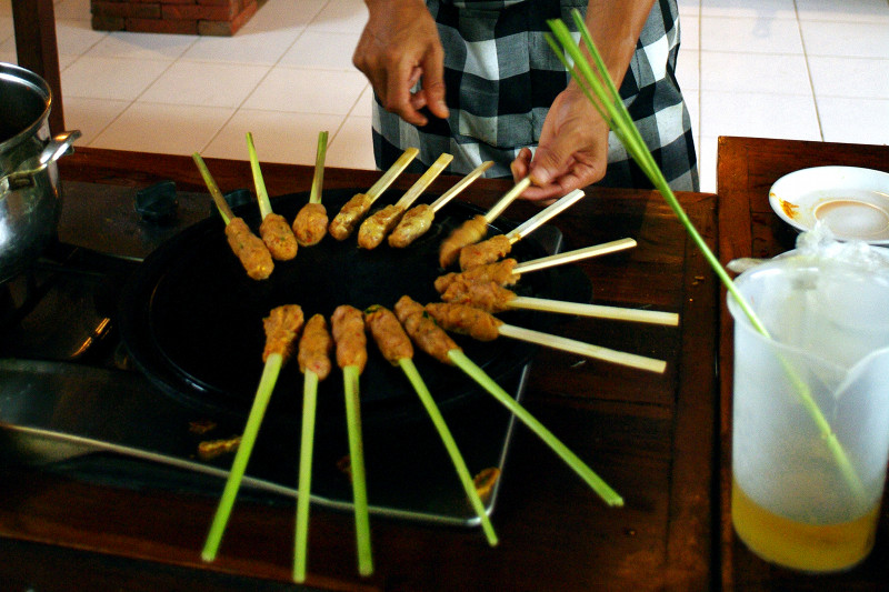 bumi bali cooking class grilling sate lilit