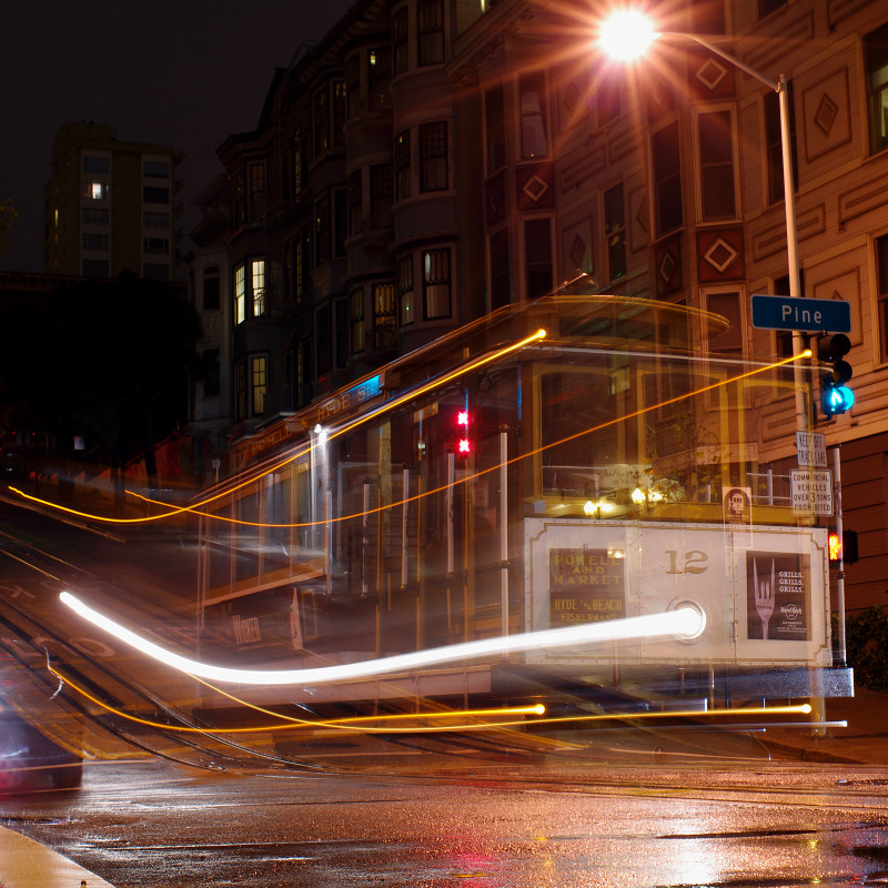 Long exposure shot of a cable car in the rain
