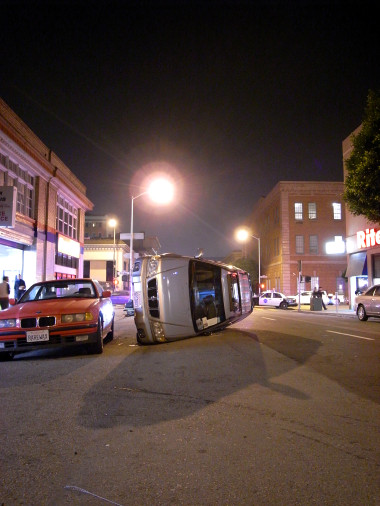 Car on its side on Larkin, between Bush and Pine