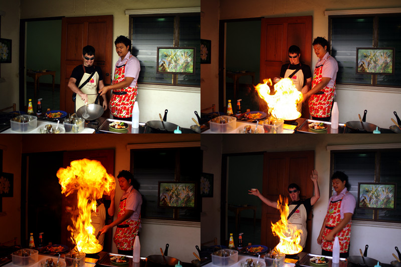 Justin making a big ball of fire in the kitchen of the Siam Rice Thai Cookery School in Chiang Mai, Thailand