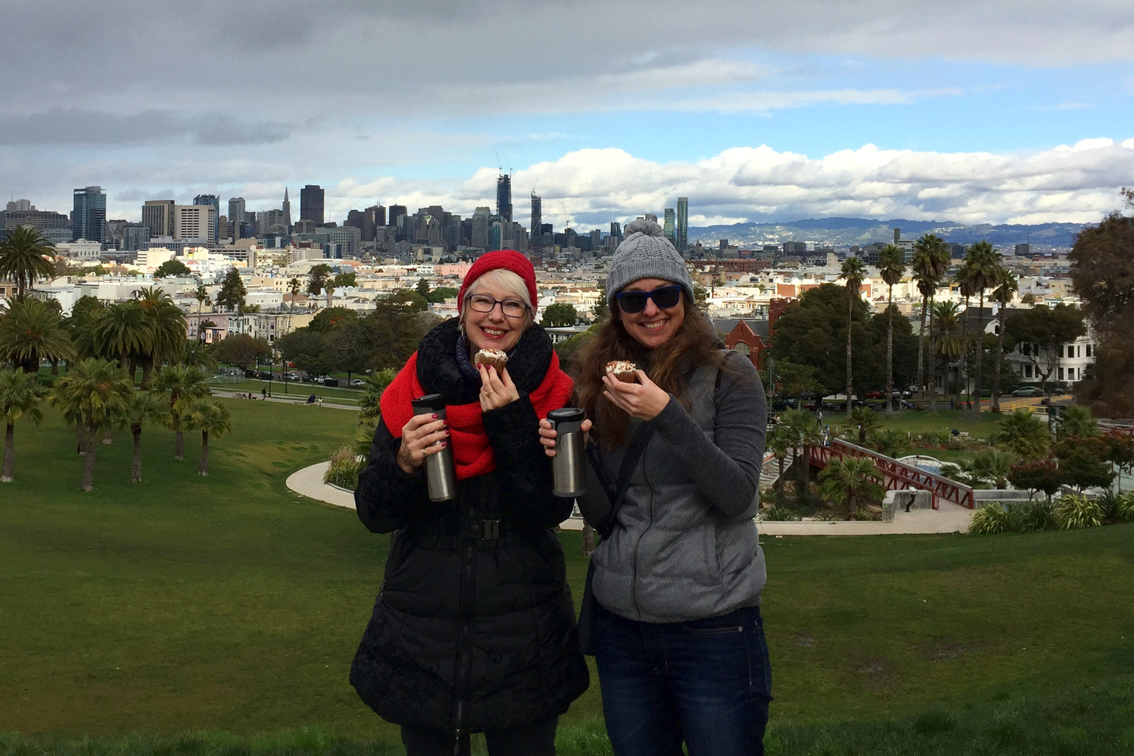 Chris and Stephanie enjoying carrot cake cupcakes with coffee in Dolores Park