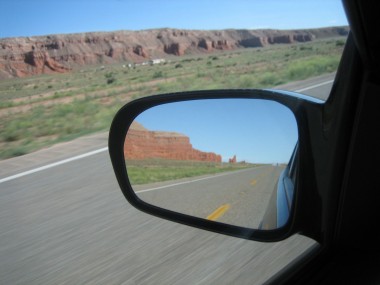 looking back at some craggy red rocks