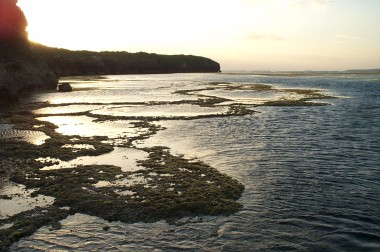 sun setting at low tide