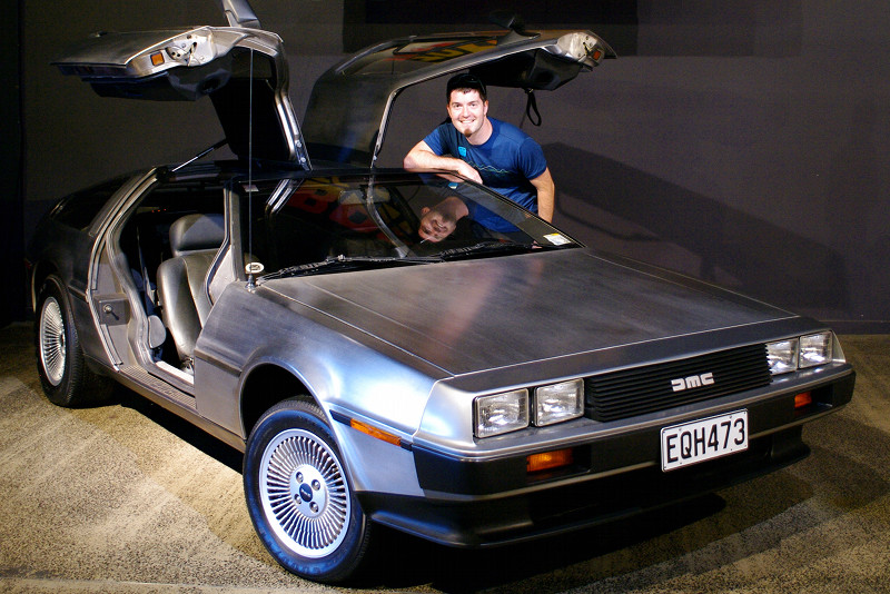 Justin posing with a 1981 DeLorean DMC-12 at the WOW Classic Cars Museum in Nelson, New Zealand