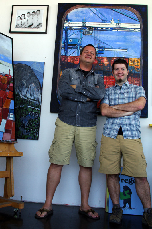 Eric Rewitzer and Justin Watt standing in front of Eric's "Portal" painting