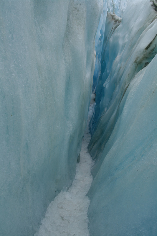 Entrance to a crevasse in Franz Josef Glacier