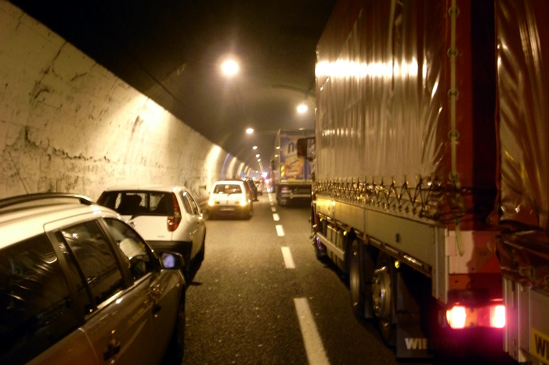 Walking out of stopped traffic in tunnel east of Genova, Italy