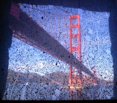 Golden Gate Bridge seen through a dirty window at Fort Point