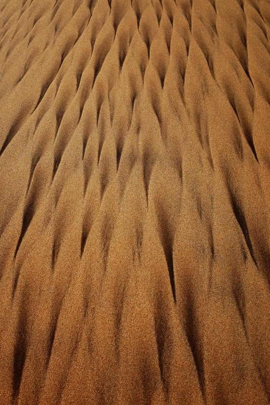 Patterns in the sand of Half Moon Bay