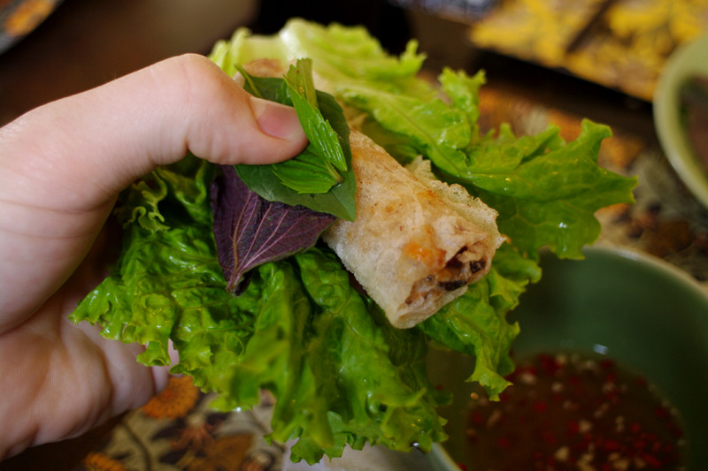 Spring roll with lettuce and fresh herbs: peppermint, perilla, thai basil