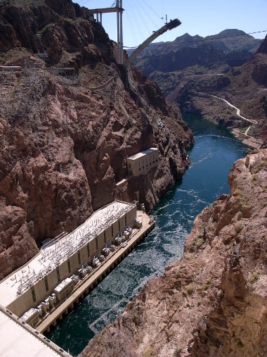 Colorado river outflow from Hoover Dam, with the new US-93 Colorado River bridge under construction in the background