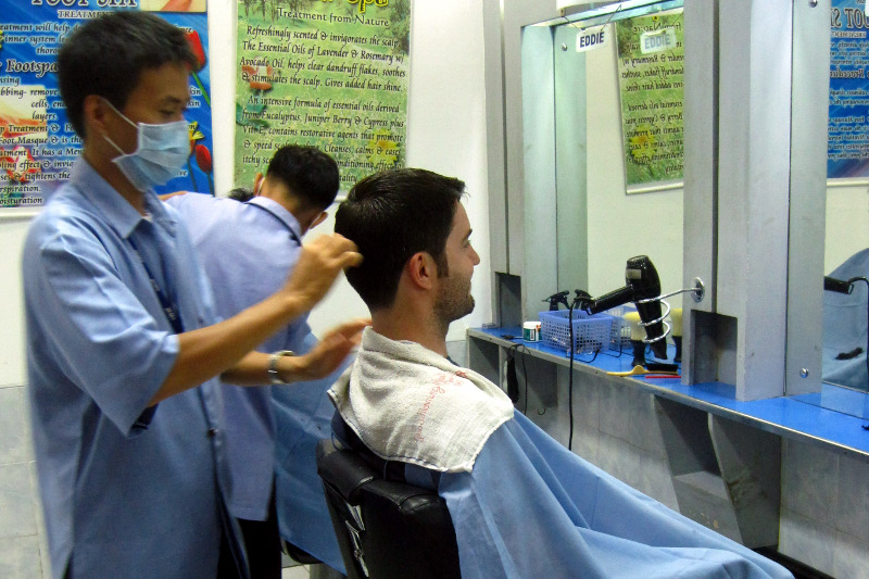 Justin getting a haircut at the barber in SM City, Iloilo