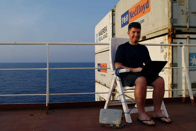 Justin using a Sabre 1 BGAN Terminal to access the internet on the Cap Cleveland, somewhere between Jamaica and Colombia