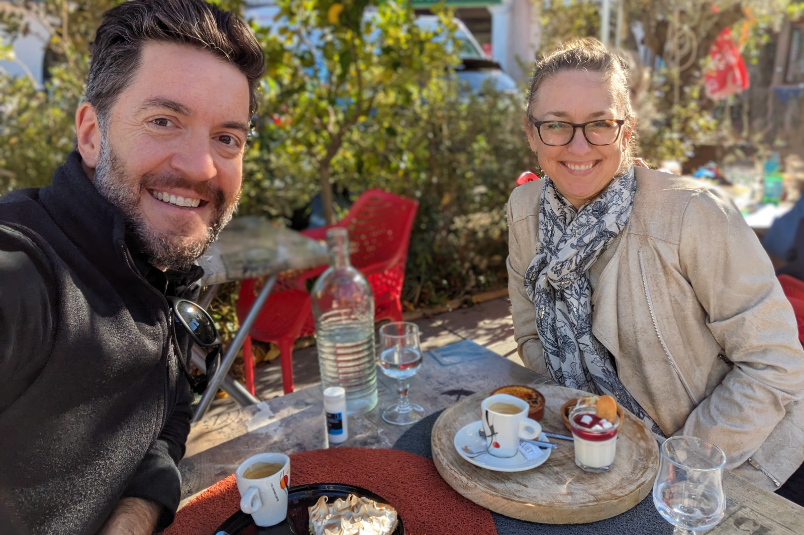 Justin and Stephanie at a brasserie in La Bouverie, France, having dessert with coffee, October 2023