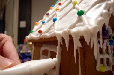 Stephanie making gingerbread house icicles