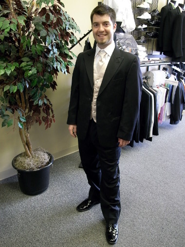 Justin trying on a tuxedo for Matthew and Beth's wedding