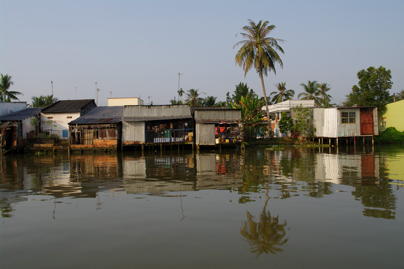 Houses along a tributary of the Cần Thơ River in the Mekong Delta