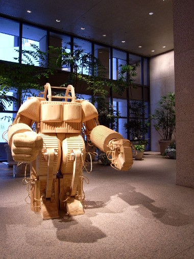 Michael Rea's wooden sculpture: A Prosthetic Suit for Stephen Hawking With Japanese Steel