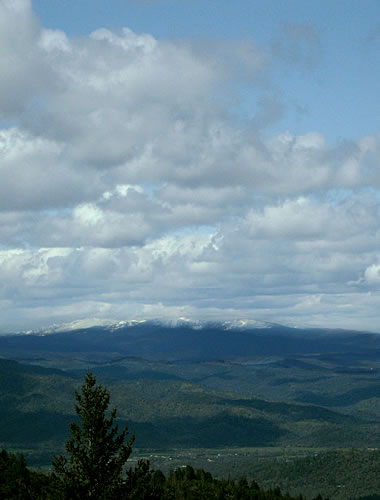 Snow covered mountains in the distance, as seen from Mt. St. Helena