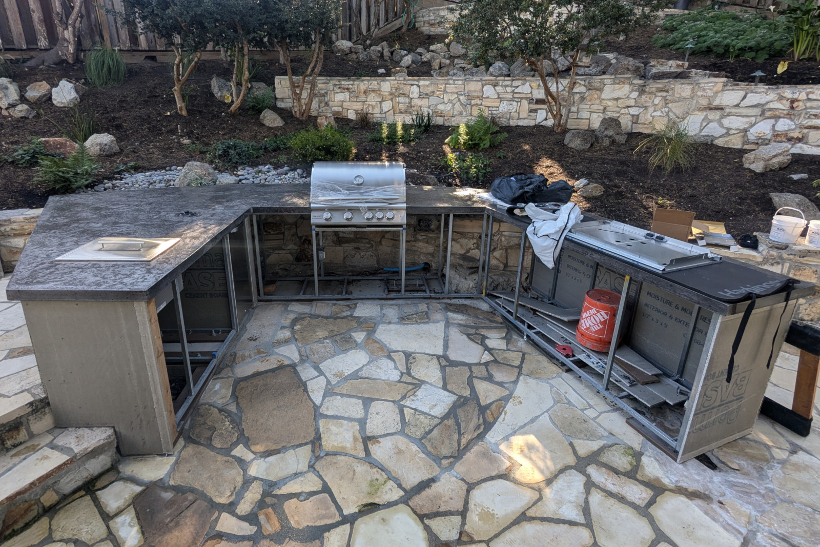 Outdoor kitchen, still in progress, with a poured-in-place concrete countertop