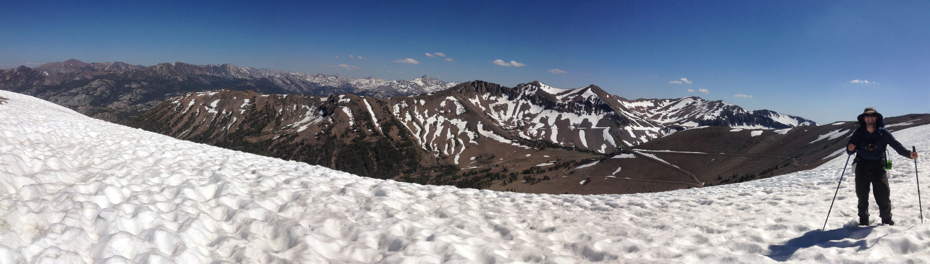 Panorama of Justin on snowfield at mile 1010 of the Pacific Crest Trail