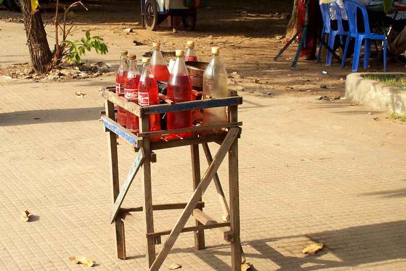 Petrol in coke bottles by the side of the road (for motos)