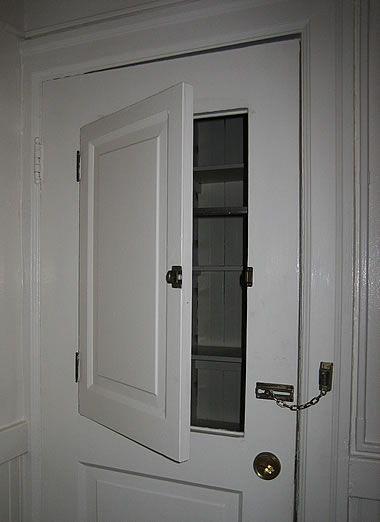 Pine Street apartment pantry door with a door