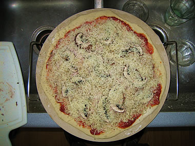 Pizza on a pizza stone, uncooked