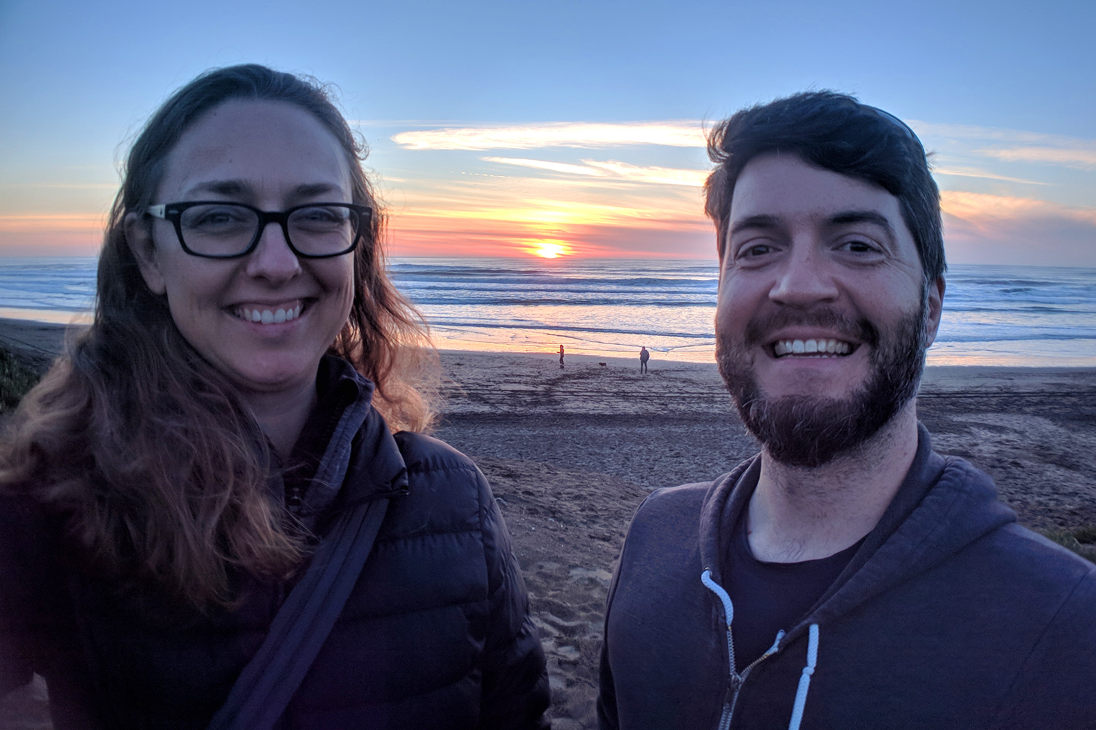 Stephanie and Justin on Ocean Beach in San Francisco, CA at sunset on January 31, 2019