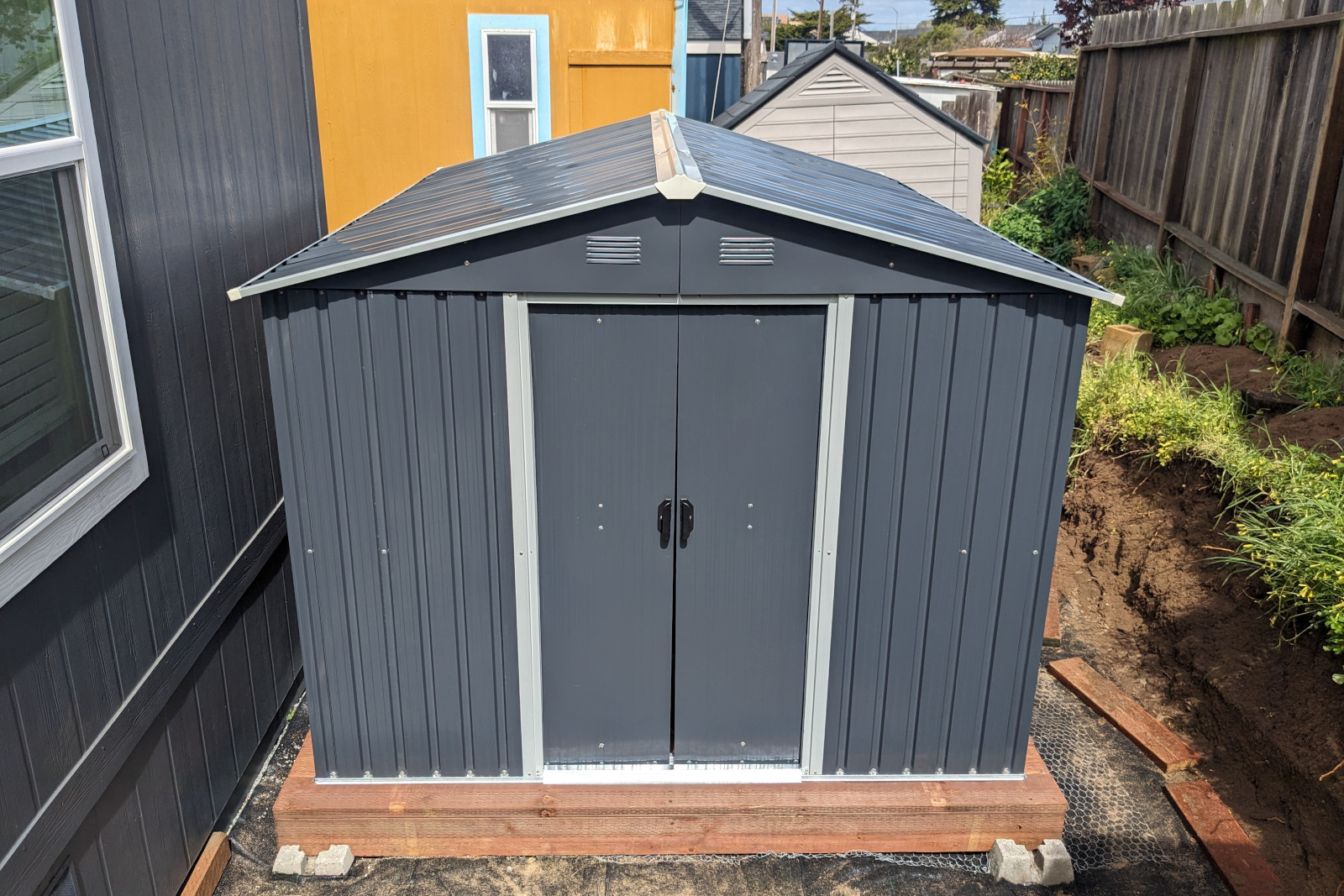 An 8x10' corrugated metal kit shed