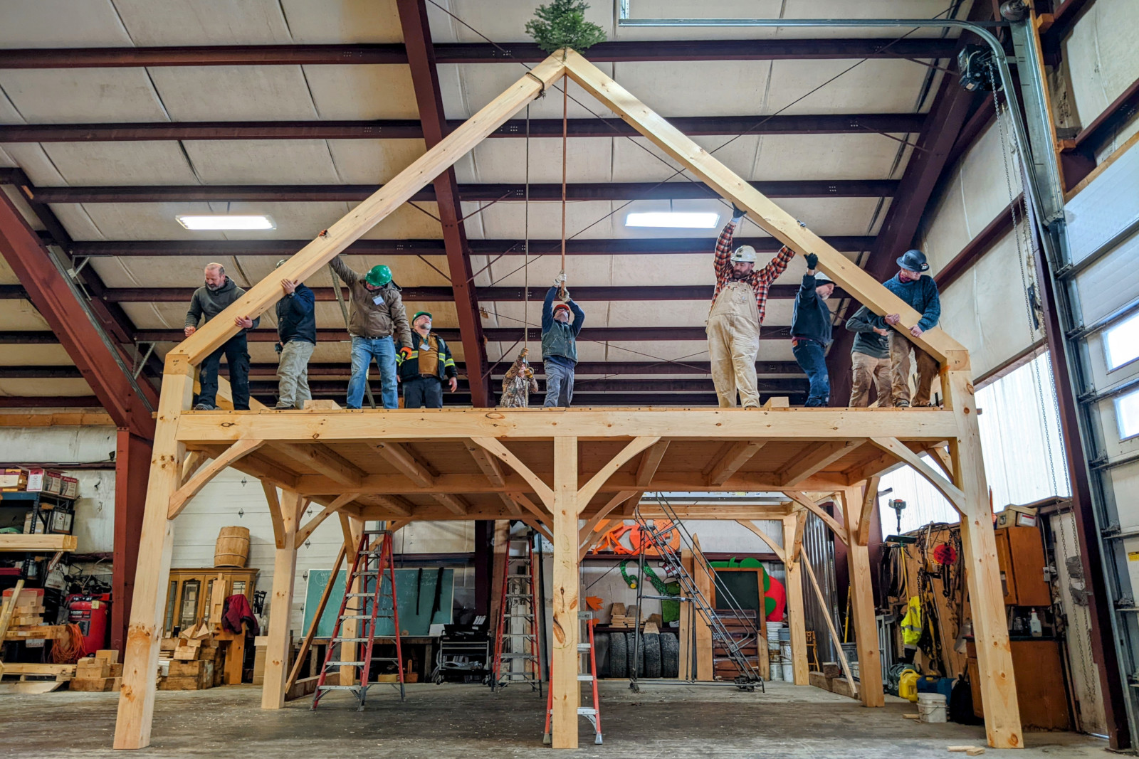 Raising the roof [rafters] on day 5 of Shelter Institute's Purely Post & Beam class