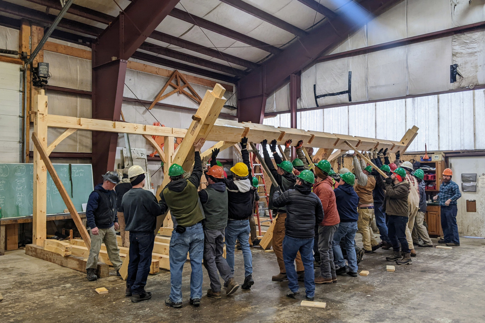 Raising the second bent on day 5 of Shelter Institute's Purely Post & Beam class