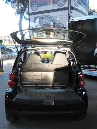 black smart fortwo with back hatch open
