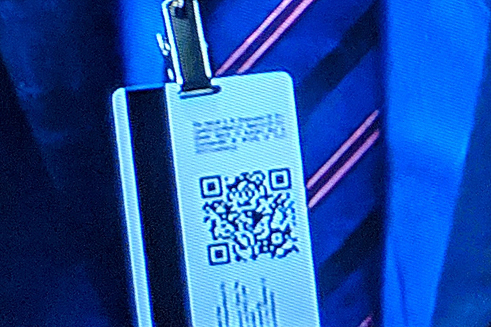 Screenshot from episode 1 of Tom Clancy's Jack Ryan, showing justinsomnia.org QR Code on James Greer's badge, super close-up