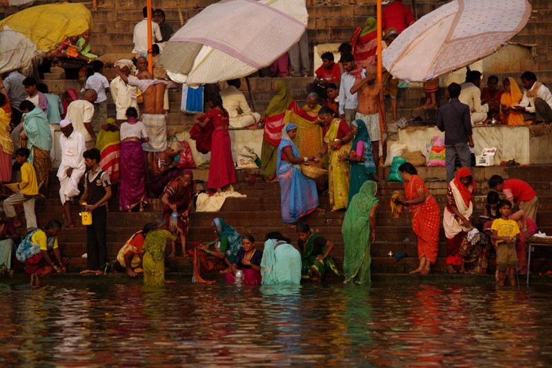 People on the ghats along the Ganges in Varanasi, India