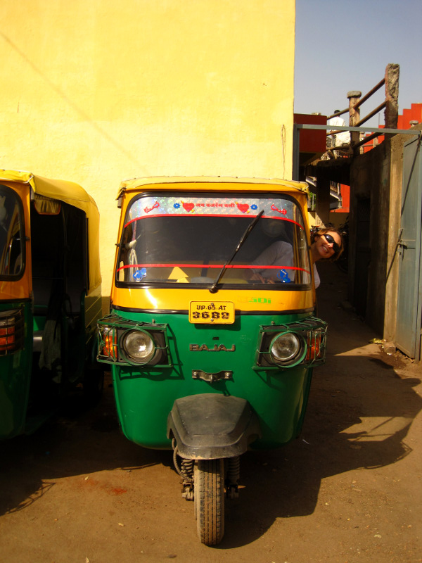 Stephanie pokes her head out of the rickshaw in Mughal Sarai, India