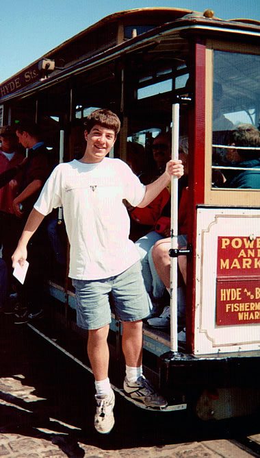 young Justin, age 13?, on a cable car